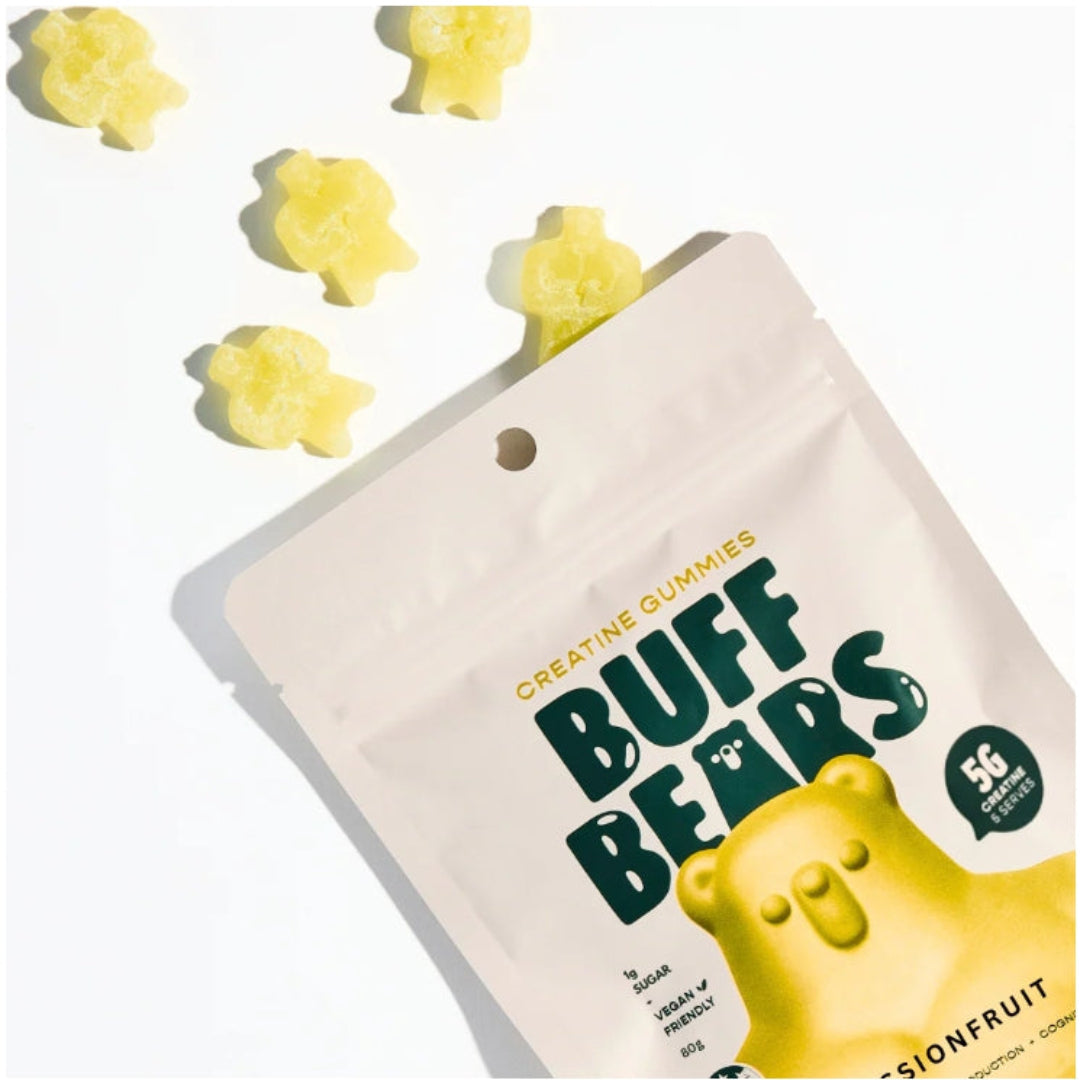 Packaging of Buff Bears gummy bears with scattered gummies on a light background